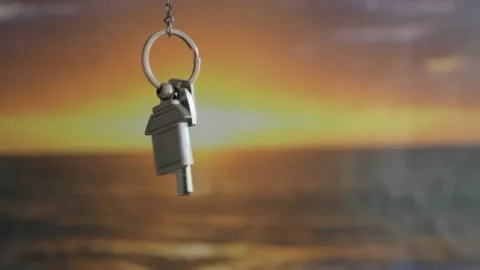 House keys with keychain rotate in the background Video stock 106481833