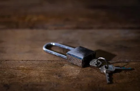 House keys left on an empty table symbolizing abandonment, separation, lone.. Stock Photos