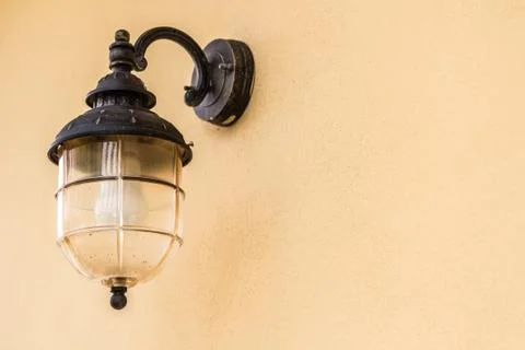 House lamp post on siding wall Stock Photos