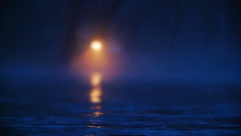 House light illuminating a surging river goes out in slow motion Stock Footage 100773365