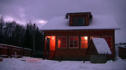 House with light in window winter at night Stock Footage 342731