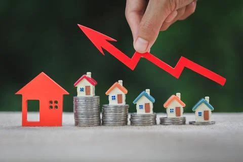 House model and a stack of coins. Real estate market, graph up arrow. The c.. Stock Photos