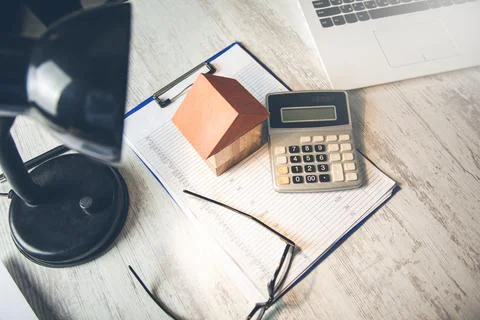 House model with calculator on document Stock Photos