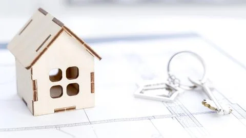 House model on construction drawings Stock Photos