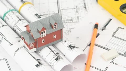 House model on construction drawings Stock Photos