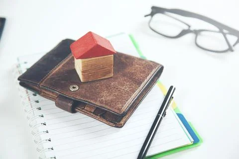 House model on wallet on notepad Stock Photos