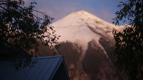A house with a mountain in the distance Stock Footage 89883138