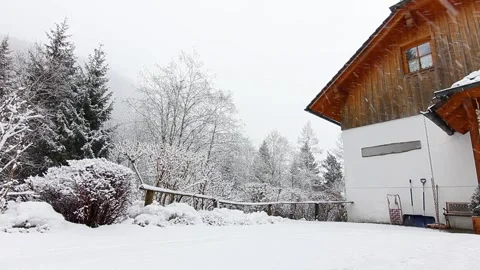 House in the mountain on the snowfall Stock Footage 295416378