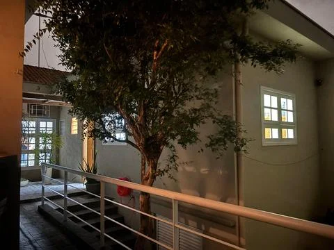 House at Night with Tree Stock Photos