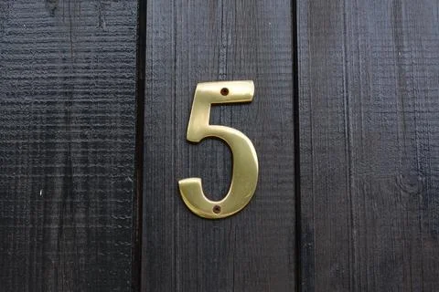House number five on wooden door outdoors, closeup Stock Photos