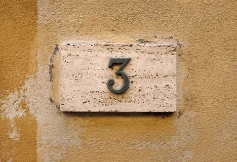 House number on wall Stock Photos