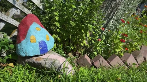 House is painted on a rock Stock Footage 247439079