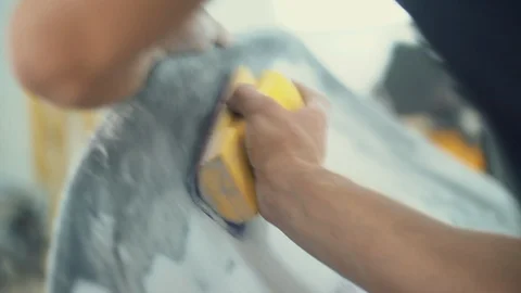 House painter manually polishes the surface of the car Stock Footage 98706184