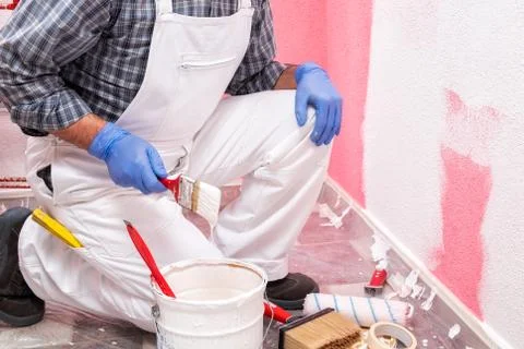 House painter worker at work in the construction site. Building. Stock-Fotos