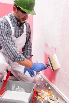 House painter worker at work in the construction site. Building. Foto stock