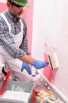House painter worker at work in the construction site. Building. Stock-Fotos