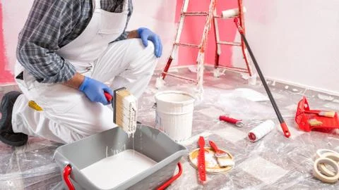 House painter worker at work in the construction site. Building. Stock-Fotos