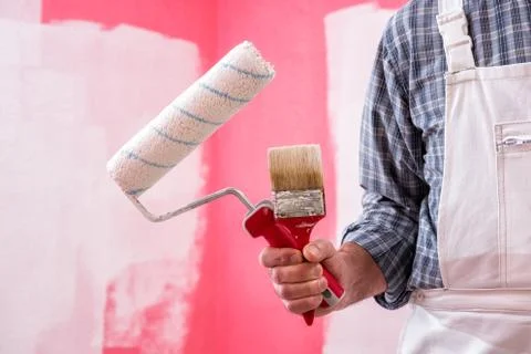 House painter worker with work tools. Construction site. Stock-Fotos