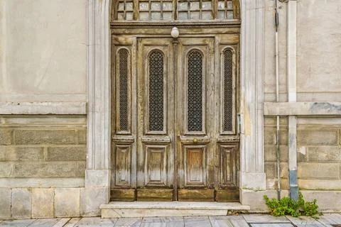 House at Peripatus Street, Athens, Greece Wooden door house at peripatus s... Stock Photos
