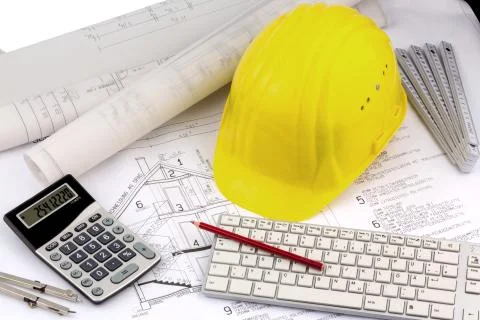 House plan with a construction worker's helmet Stock Photos