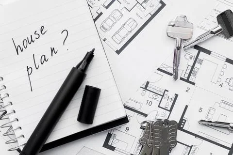 House plan with question mark sign written notebook with felt tip pen keys blue Stock Photos