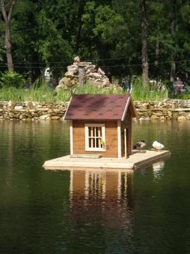 House with pond Stock Photos