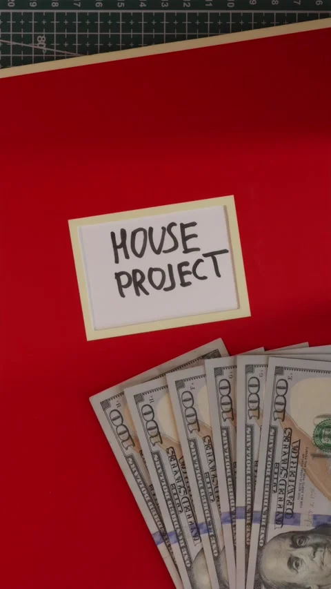 House Project red folder with US dollar cash flat lay Stock Footage 341246092