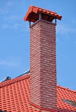 House from a red brick with a pipe Stock Photos