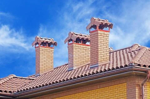 House from a red brick with a pipe Stock Photos