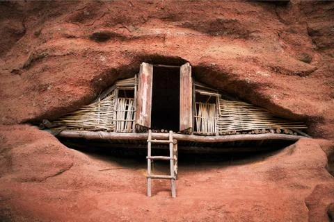 House in red rock mountain Stock Photos