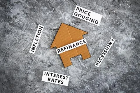 House with refinance text surrounded by concepts like interest rates inflatio Stock Photos