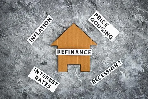 House with refinance text surrounded by concepts like interest rates inflatio Stockfoto's