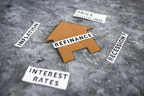 House with refinance text surrounded by concepts like interest rates inflatio Stock Photos