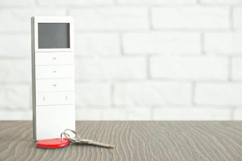 House remote controller with display and metallic keys from the door Stock Photos