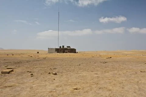 House in sandy desert close to the cliffs. Perfect place to see tropical de.. Stock Photos