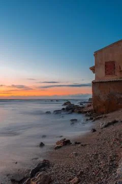 House by the sea on a sunset Stock Photos