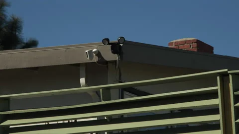House Security Camera and motion sensor lights with fence Stock Footage 146983857