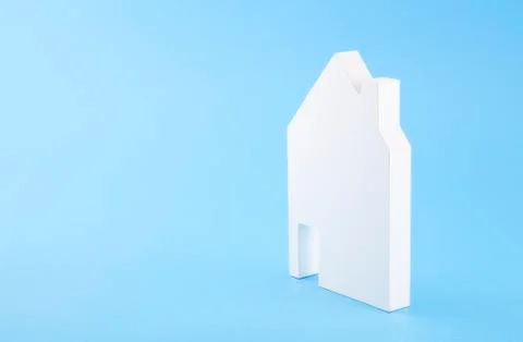 House shape on blue background Stock Photos
