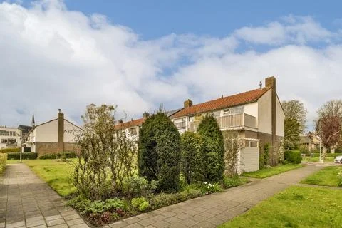 A house with a sidewalk in front of it Stock Photos