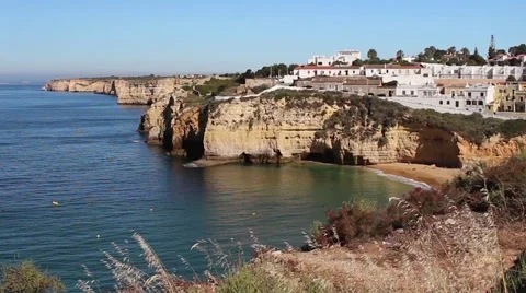 House sitting atop cliffs overlooking a picturesque bay. Stock Footage 64959371