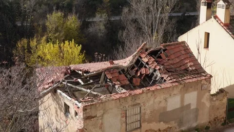 A house in Spain with a visibly destroyed rooftop Stock Footage 294821634