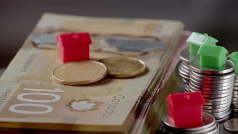 House on stack of Canadian dollars rotating in circle, Canadian Banknotes Money Stock Footage 266340553