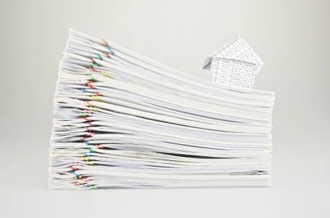 House on stack old paperwork Stock Photos