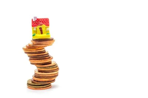 House on stack on white background. Concept uncertainty in the real estate ho Stock Photos