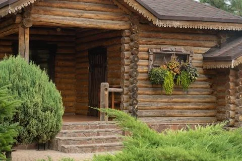 The house stands a steady state of elegant trees and shrubs. Landscaping Stock Photos