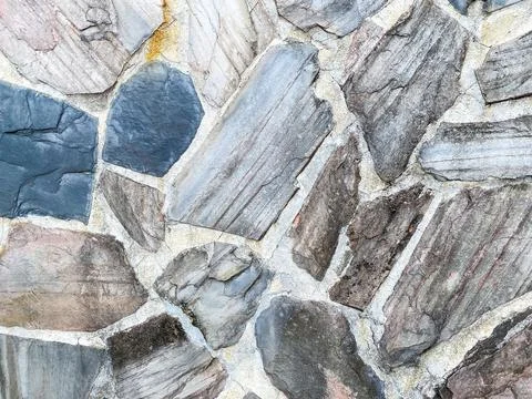 House stone wall as the background texture Stock Photos