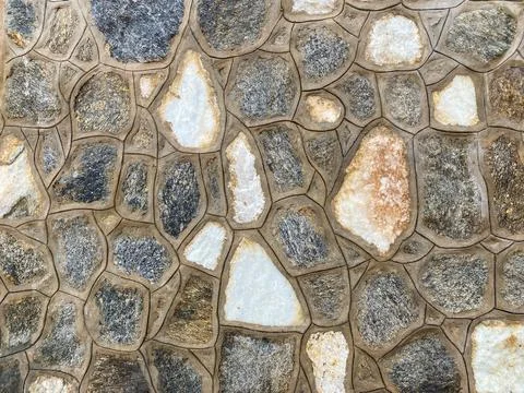 House stone wall as the background texture Stock Photos