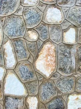 House stone wall as the background texture Stock Photos