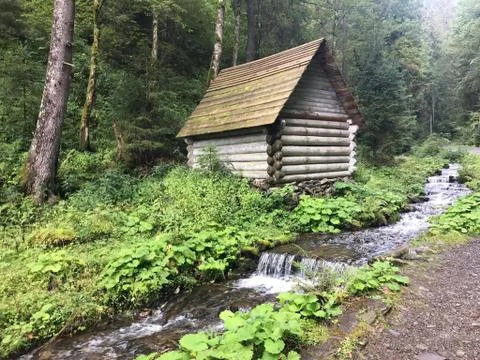 House by the stream Stock Photos