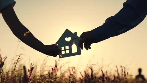 House at sunset. hand close-up. epotheca house purchase. dream to buy jelly Stock Footage 248531289